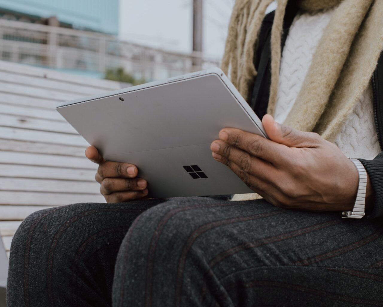 Person holding a Microsoft tablet