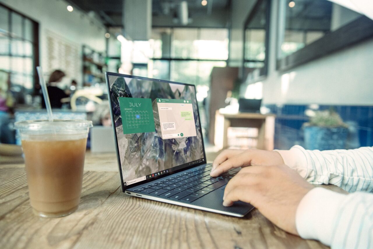 Individual working on their computer from home or a coffee shop